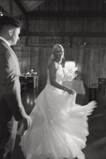 Emma’s skirt swinging out as she dances, in black and white.