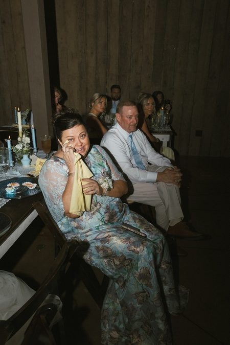 Emma’s parents watching from their seats during the reception.