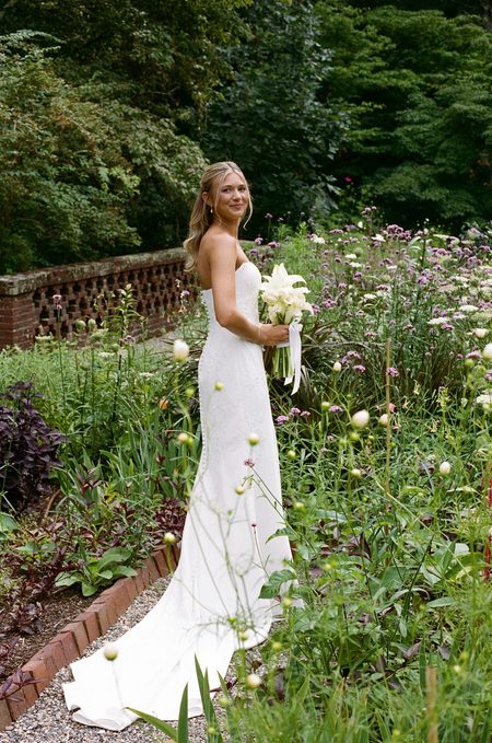Kendra looking back over her shoulder in the wildflower garden.