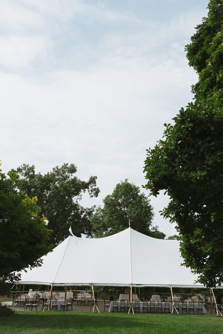 The reception tent under an open summer sky at The Bradley Estate.