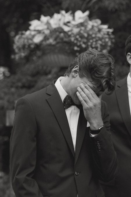 Will overcome as Kendra walks toward him down the aisle, in black and white.