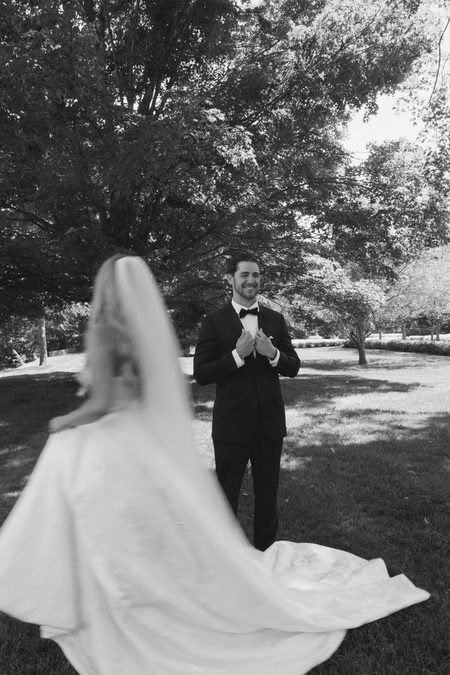 Nick’s reaction as Stephanie turns for their first look, in black and white.