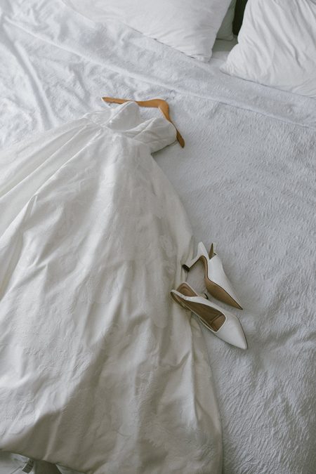 Stephanie’s heels resting on the skirt of her gown.